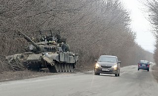 Russische Truppen am 24. Februar 2022 beim Einmarsch in die Ukraine. - Alexander Ryumin/TASS/dpa Russische Truppen am 24. Februar 2022 beim Einmarsch in die Ukraine. - Alexander Ryumin/TASS/dpa