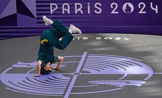 Während ihres Aiftritts bei den Olympischen Spielen wälzte sich Gunn auf dem Boden oder hüpfte wie ein Känguru. - Abbie Parr/AP/dpa Während ihres Aiftritts bei den Olympischen Spielen wälzte sich Gunn auf dem Boden oder hüpfte wie ein Känguru. - Abbie Parr/AP/dpa