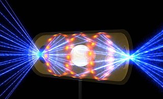 Diese Illustration zeigt ein NIF-Target-Pellet in einer Hohlraumkapsel mit Laserstrahlen, die durch Öffnungen an beiden Enden eintreten. Die Strahlen komprimieren und erhitzen das Target auf die Bedingungen, die für die Kernfusion erforderlich sind. - --/Lawrence Livermore National Laboratory/dpa Diese Illustration zeigt ein NIF-Target-Pellet in einer Hohlraumkapsel mit Laserstrahlen, die durch Öffnungen an beiden Enden eintreten. Die Strahlen komprimieren und erhitzen das Target auf die Bedingungen, die für die Kernfusion erforderlich sind. - --/Lawrence Livermore National Laboratory/dpa