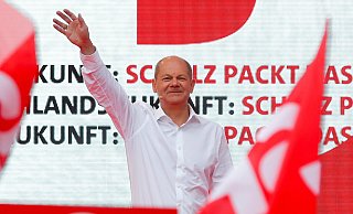 Bei seiner Abschlussveranstaltung in Köln zeigte sich Olaf Scholz siegessicher. - Reuters Bei seiner Abschlussveranstaltung in Köln zeigte sich Olaf Scholz siegessicher. - Reuters