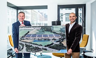 Stolz auf das gemeinsame Projekt: Bürgermeister Elmar Schröder (l.) und der Managing-Director von Scannell-Properties, Jordan Corynen, präsentieren eine Visualisierung der Pläne an der Autobahnauffahrt Diemelstadt. - Scannell Properties Stolz auf das gemeinsame Projekt: Bürgermeister Elmar Schröder (l.) und der Managing-Director von Scannell-Properties, Jordan Corynen, präsentieren eine Visualisierung der Pläne an der Autobahnauffahrt Diemelstadt. - Scannell Properties